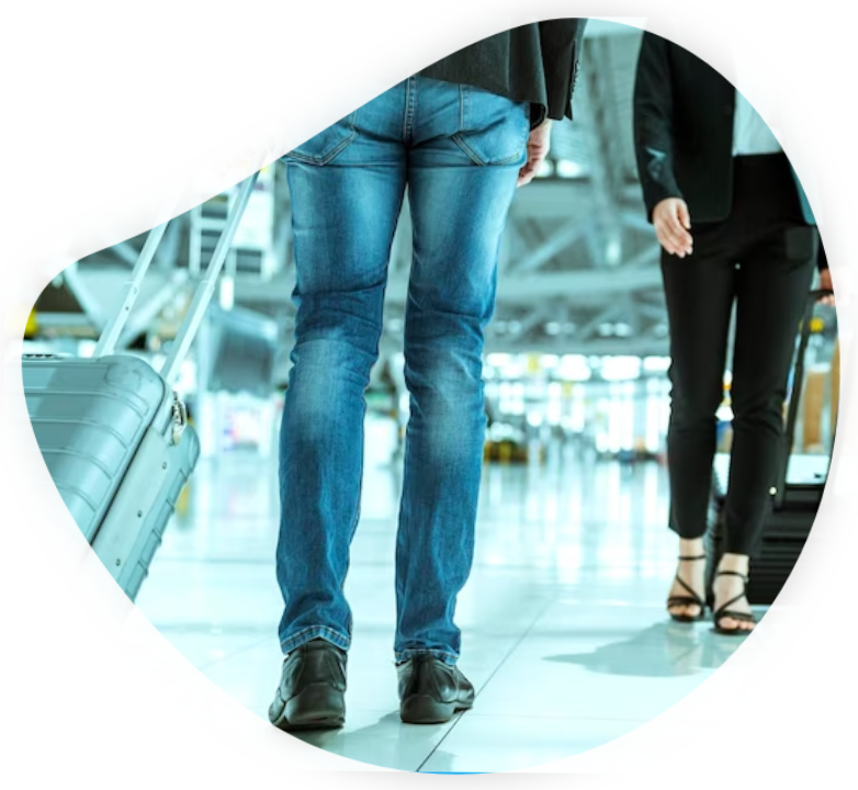 A man is standing with his luggage